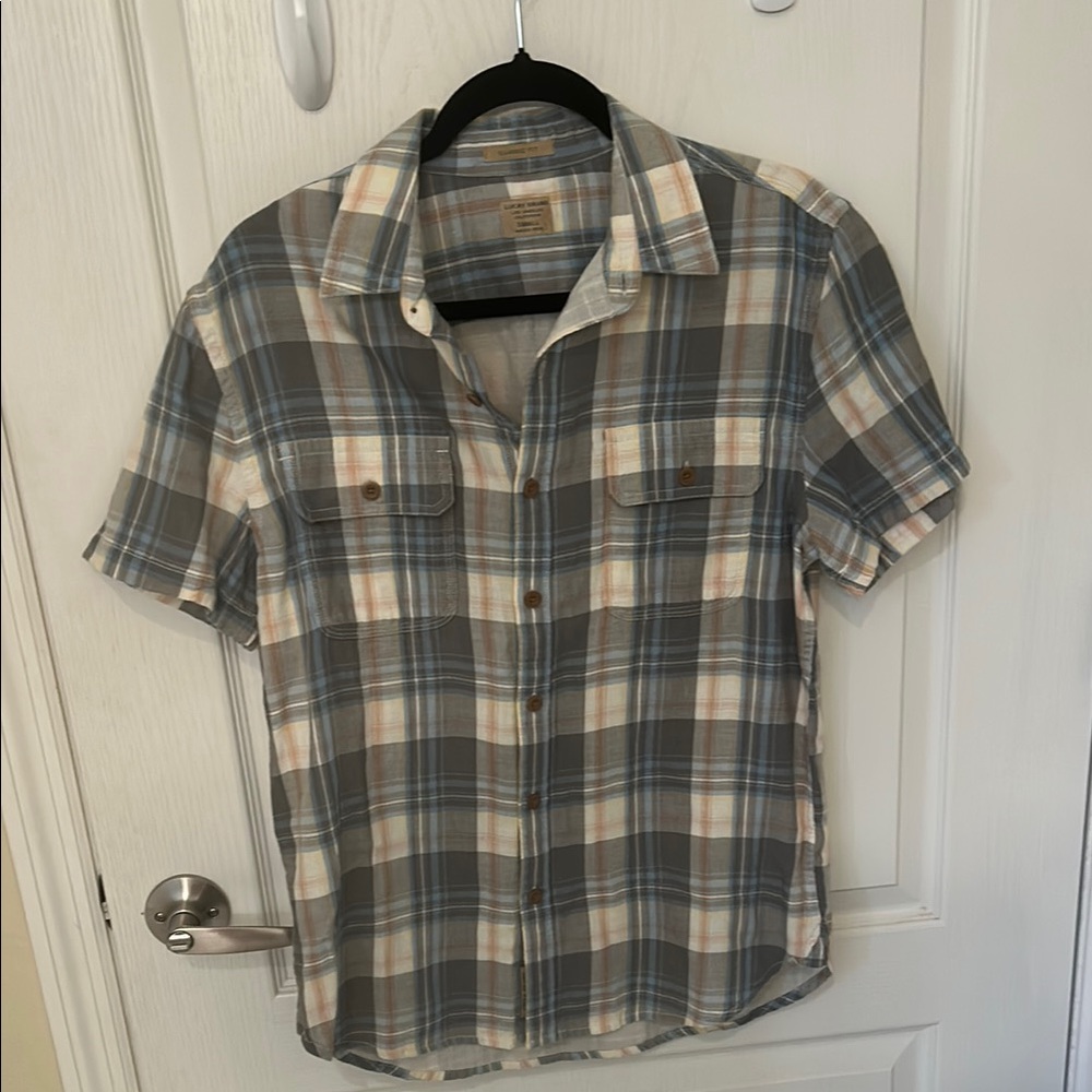 Lucky Brand plaid button down shirt two pockets in front. Size small